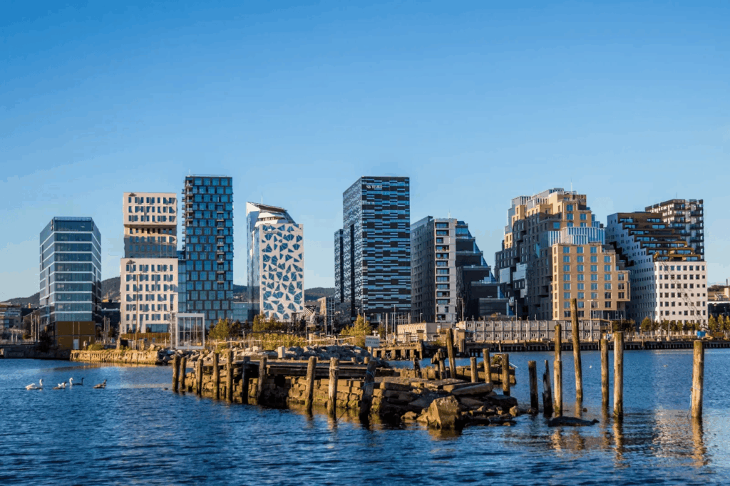 Urban Oases 2026: Explore the World’s Top Green Cities & Parks 2 Oslo cityscape with iconic buildings, harbor in the foreground.