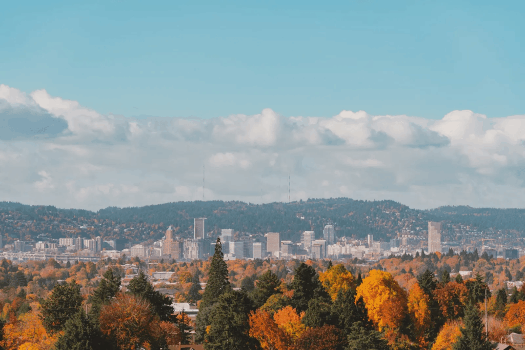 Urban Oases 2026: Explore the World’s Top Green Cities & Parks 10 Portland city with skyscrapers and green skyline.