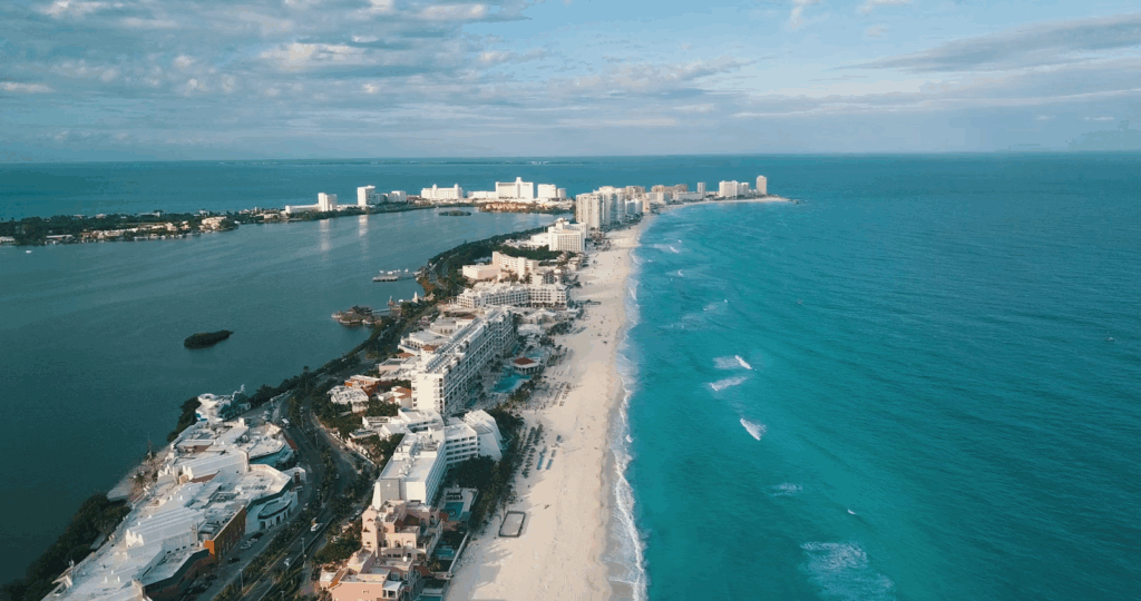 Affordable Summer Vacations: Top Budget Destinations & Tips 5 Cancún, Mexico: aerial view of the coastline with turquoise sea and resort buildings along the beach