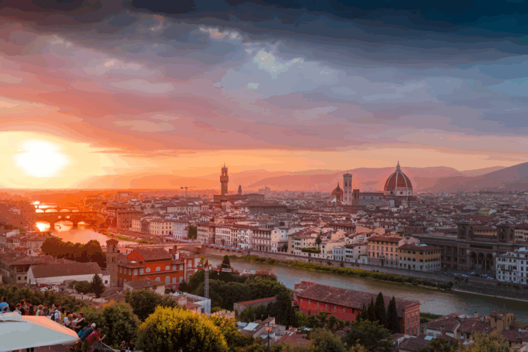 Best City in Italy for First Timers: Top 7 Destinations 2025 5 Aerial view of Florence, Metropolitan City of Florence, Italy, showcasing its iconic red-tiled roofs, the Arno River winding through the city, and landmarks like the Duomo and Ponte Vecchio set against a backdrop of rolling Tuscan hills.