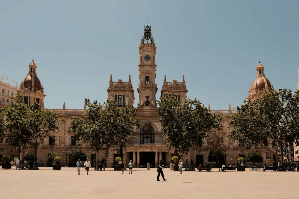Best City in Spain for First Timers: Top 7 Destinations 2025 5 A large building with a clock tower on top of it