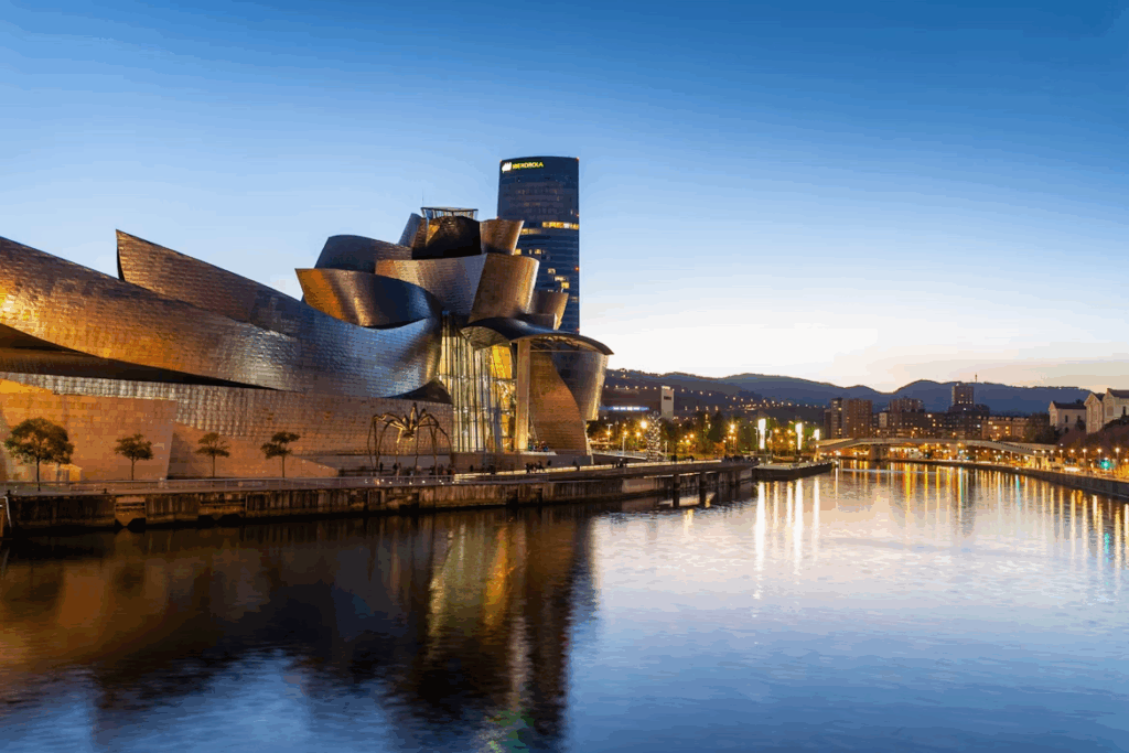 Best City in Spain for First Timers: Top 7 Destinations 2025 7 A large building next to a body of water