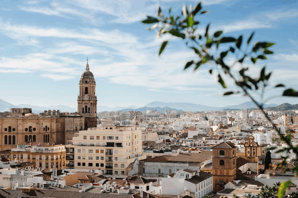 Best City in Spain for First Timers: Top 7 Destinations 2025 8 A view of a city with tall buildings and a clock tower