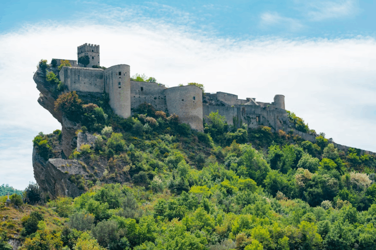Best Village in Abruzzo: 7 Hidden Gems You Must Visit Now 6 a castle on top of a hill surrounded by trees