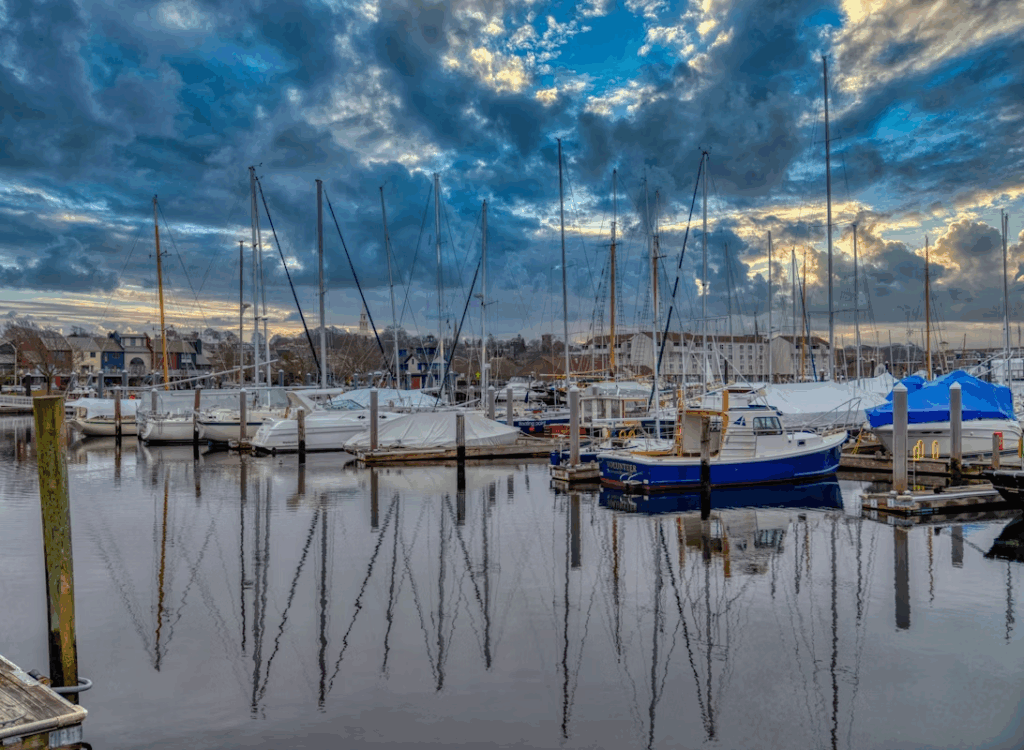 12 Stunning Photogenic Fishing Villages on the US East Coast 10 white and blue boats on body of water under blue and white cloudy sky during daytime