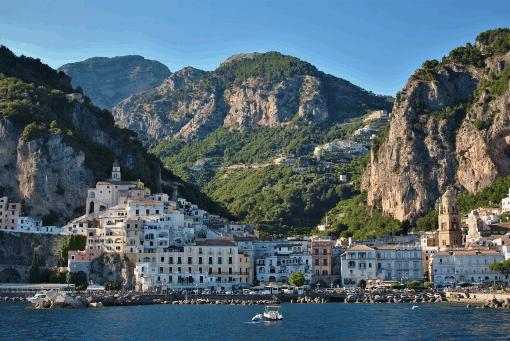What is the Best Way to Travel Through Italy? 2025 Guide 5 White and brown concrete buildings near body of water during daytime