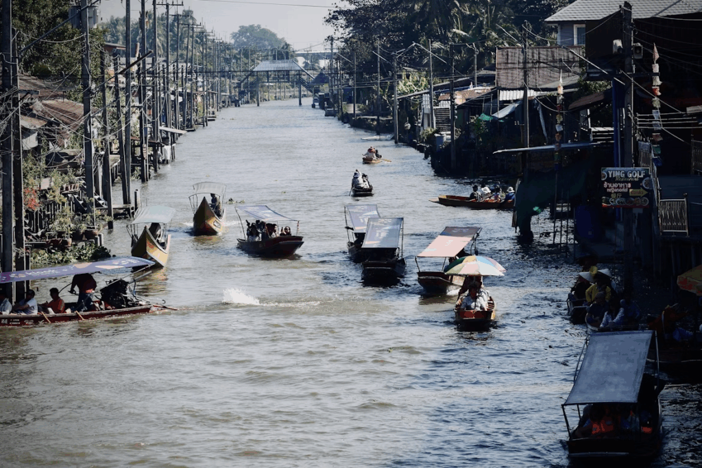 Discover 10 Incredible Floating Markets in Bangladesh Today 17 a-group-of-people-riding-boats-down-a-river