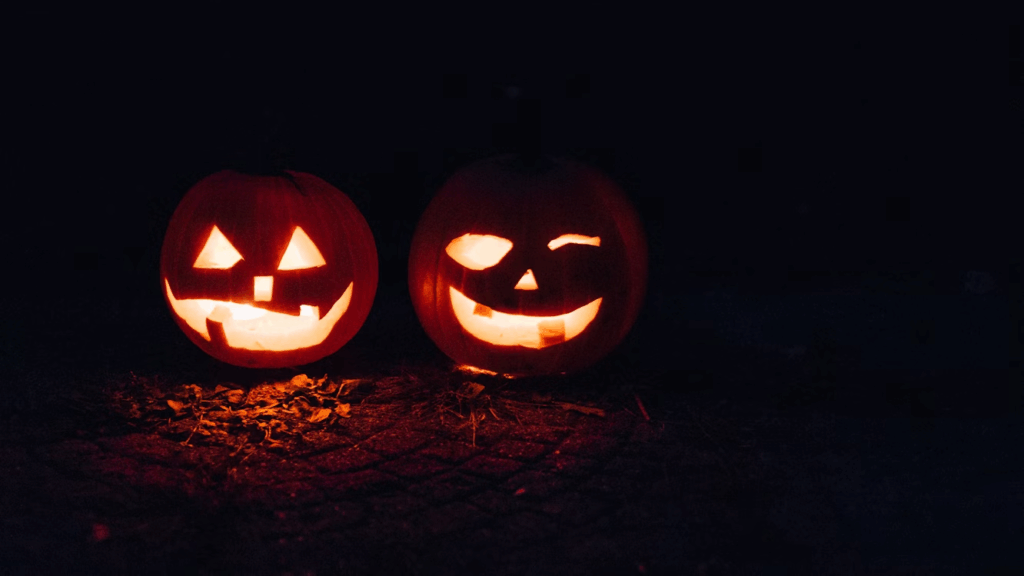 two-lighted-jack-o-lanterns-during-night-time