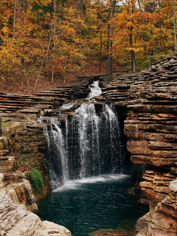 waterfalls in the middle of the forest
