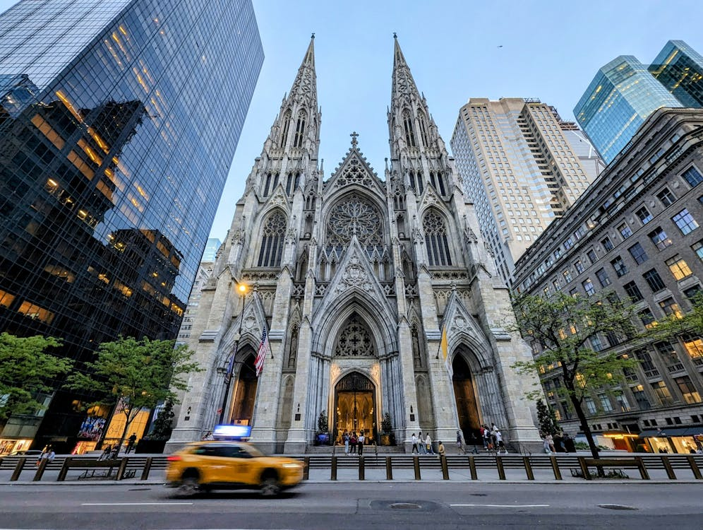 Categories 3 facade of St. Patrick's Cathedral and skyscrapers in New York USA.