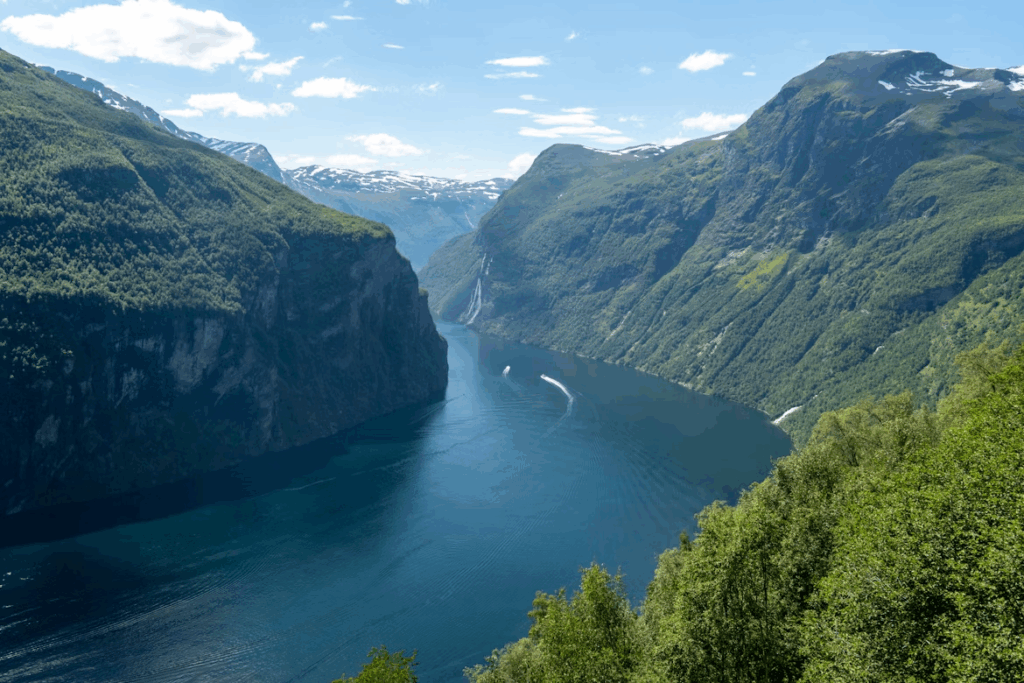 5 Powerful Kayaking in the Norwegian Fjords Experiences Now 2 a-scenic-view-of-a-river-surrounded-by-mountains