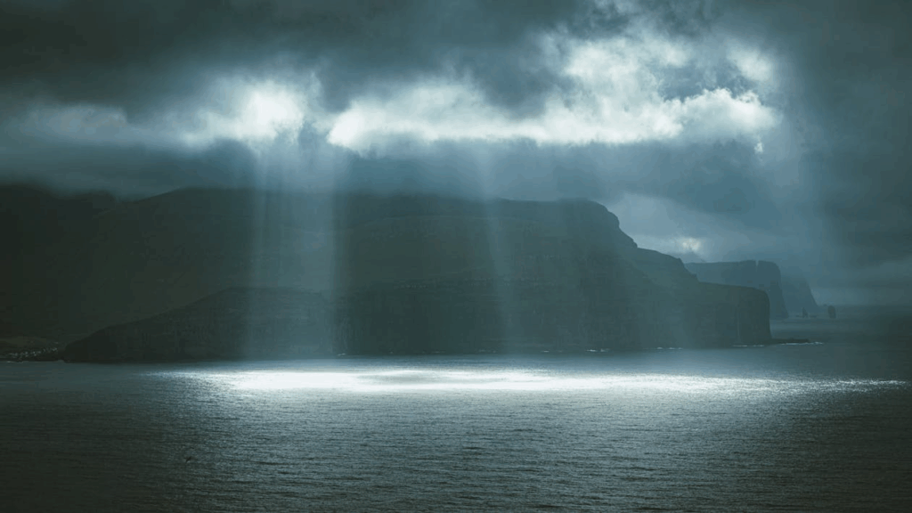 10 stunning Facts Why Faroe Islands Are a Dream Photo Spot 7 sun-shining-through-dark-clouds-over-the-faroe-islands