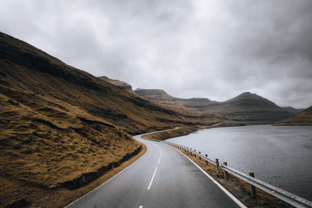 10 stunning Facts Why Faroe Islands Are a Dream Photo Spot 10 a-road-next-to-a-body-of-water
