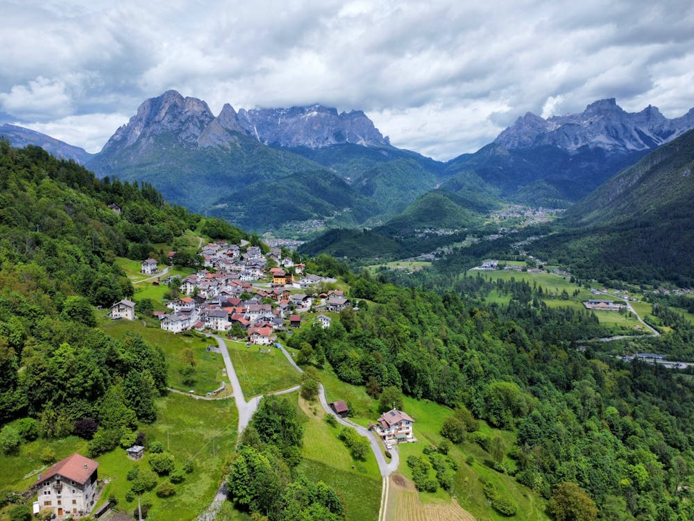 Top 9 Best Traditional Villages in the Italian Alps Revealed 5 aerial-view-of-agordo-veneto-with-dolomites-backdrop