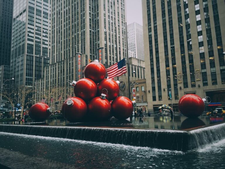 big red bauble fountain near buildings in new york city