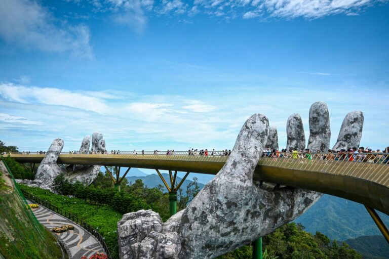 Golden Bridge at Ba Na Hills with people walking across it in in Da Nang